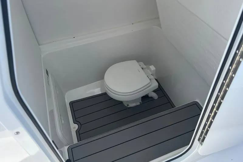 Slide: The Image of 2026 Cape Horn 27XS boat interior with compact marine toilet. - 17