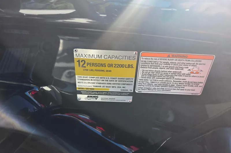 Slide: The Image of 2018 Yamaha AR240 capacity label, maximum 12 persons or 2200 lbs, safety warnings included. - 14