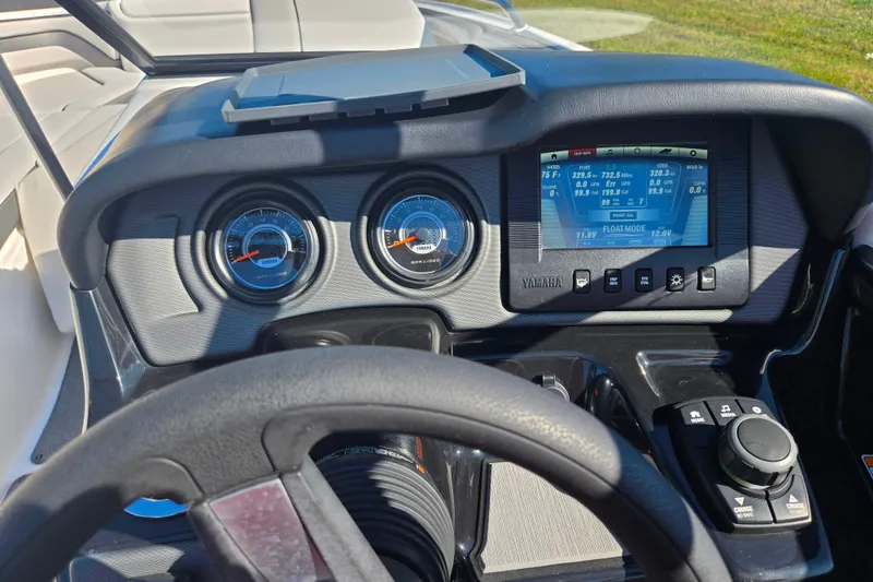 Slide: The Image of Dashboard of 2018 Yamaha Boats AR240 with gauges and digital display. - 15