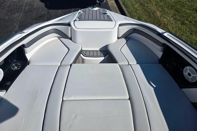 Slide: The Image of 2018 Yamaha Boats AR240 interior with cushioned seating and speakers. - 17