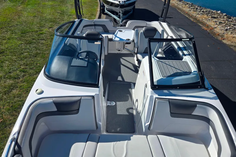 Slide: The Image of 2018 Yamaha Boats AR240 interior view, featuring sleek seating and modern design. - 20