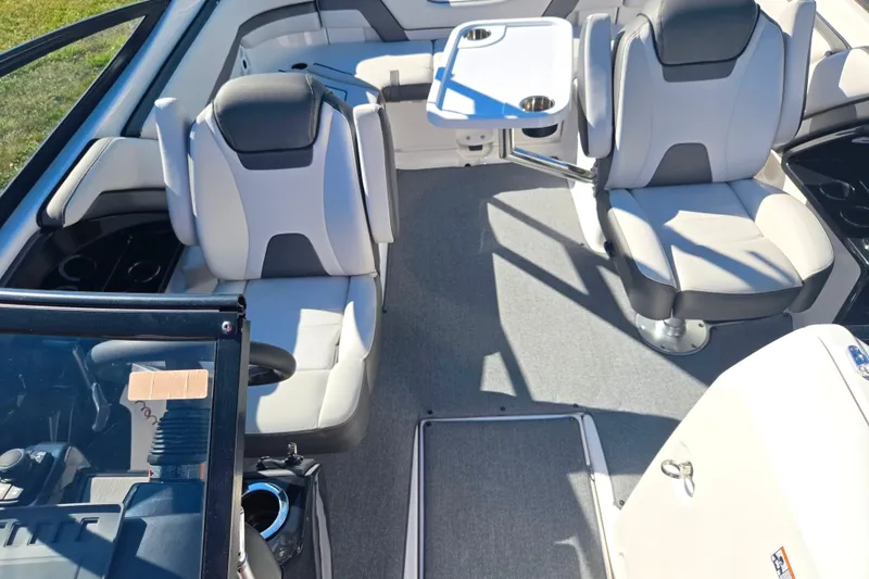 Slide: The Image of 2018 Yamaha Boats AR240 interior with seating and table, showcasing modern design and comfort. - 21