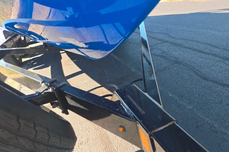 Slide: The Image of 2018 Yamaha Boats AR240 on trailer, close-up view of hull and wheel. - 7