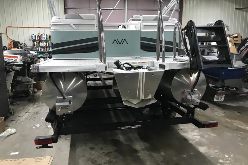 Slide: The Image of 2026 Avalon Venture Quad Lounger 19' pontoon boat in a workshop setting. - 11