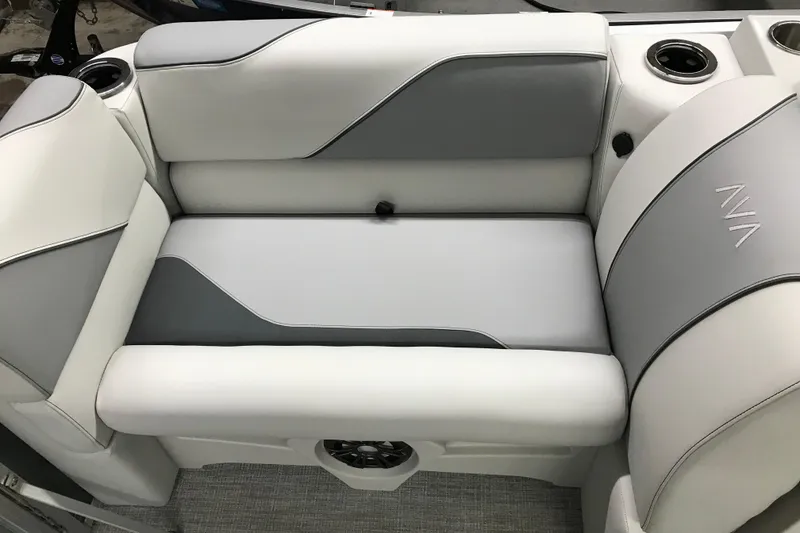 Slide: The Image of 2026 Avalon Venture Quad Lounger 19' boat seating with cup holders and sleek design. - 29
