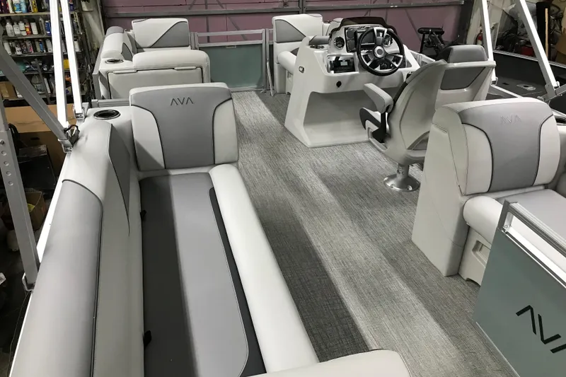 Slide: The Image of 2026 Avalon Venture Quad Lounger 19' interior with modern seating and steering console. - 31