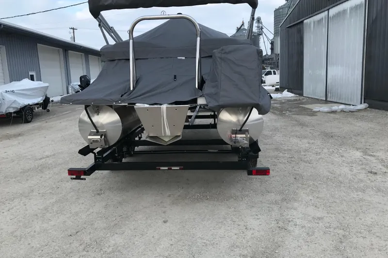 Slide: The Image of 2026 Avalon Venture Quad Lounger 19' pontoon boat covered and on a trailer. - 8