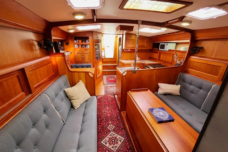 Slide: The Image of Luxurious interior of 1995 Able Apogee 50 yacht with wood paneling and plush seating. - 6
