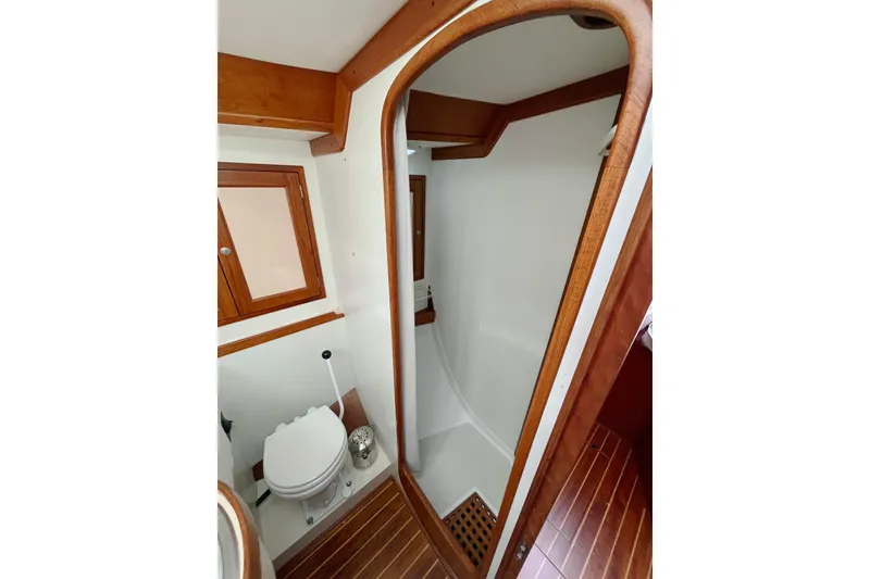 Slide: The Image of Bathroom interior of 1995 Able Apogee 50 yacht with wooden accents and shower. - 5