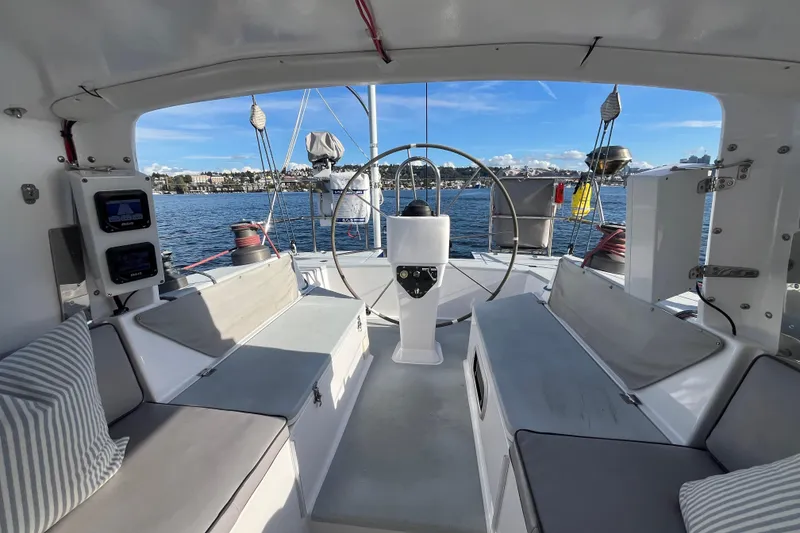 Slide: The Image of Interior view of 1995 Able Apogee 50 sailboat cockpit with seating and steering wheel. - 56