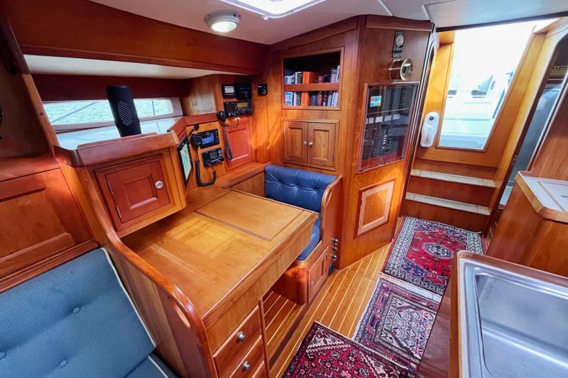 Slide: The Image of Interior of 1995 Able Apogee 50 yacht with wooden cabinetry and navigation equipment. - 11