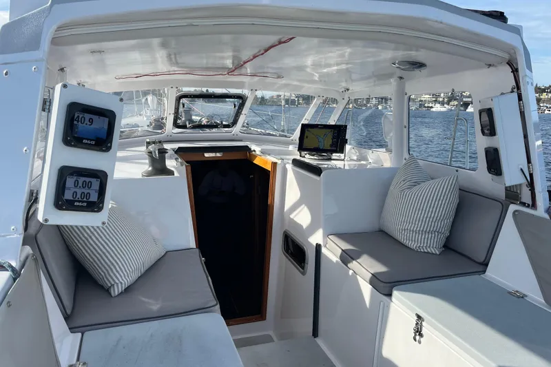 Slide: The Image of Interior view of 1995 Able Apogee 50 sailboat with navigation equipment and seating. - 49