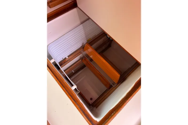 Slide: The Image of Interior view of a 1995 Able Apogee 50 yacht storage compartment. - 23