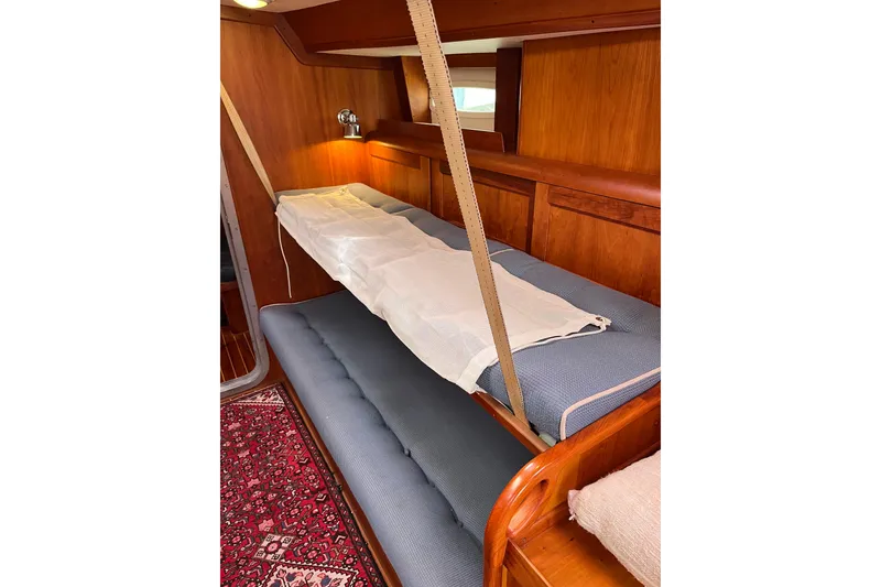 Slide: The Image of Interior of 1995 Able Apogee 50 yacht with wooden bunk beds and nautical decor. - 21