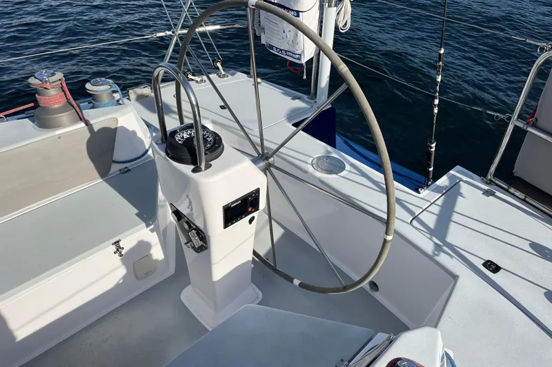 Slide: The Image of Cockpit of 1995 Able Apogee 50 sailboat with steering wheel and navigation equipment. - 60