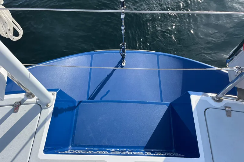 Slide: The Image of Blue deck of 1995 Able Apogee 50 sailboat with water view. - 63