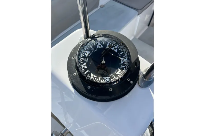 Slide: The Image of Boat compass on Able Apogee 50, 1995 model, showing cardinal directions. - 61