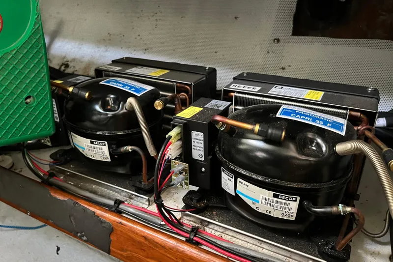 Slide: The Image of Two Secop compressors in a refrigeration system, model Capri 35 F, 1995. - 34