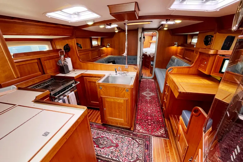 Slide: The Image of Luxurious 1995 Able Apogee 50 yacht interior with wood finish and modern amenities. - 14