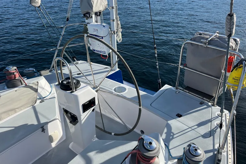 Slide: The Image of Cockpit of 1995 Able Apogee 50 sailboat with steering wheel and winches. - 59