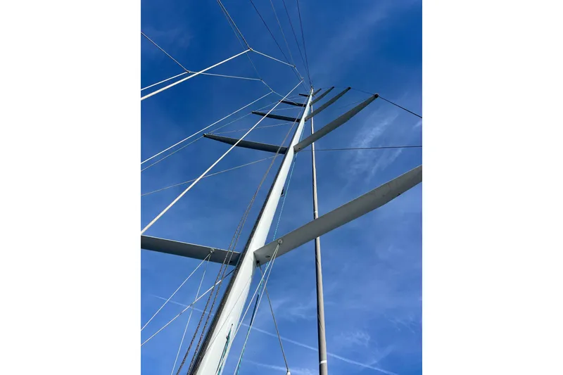 Slide: The Image of Sailboat mast and rigging against a clear blue sky, Able Apogee 50, 1995. - 39