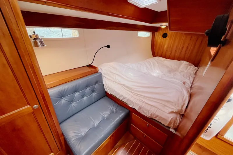 Slide: The Image of Cozy cabin interior of 1995 Able Apogee 50 yacht with bed and seating area. - 16