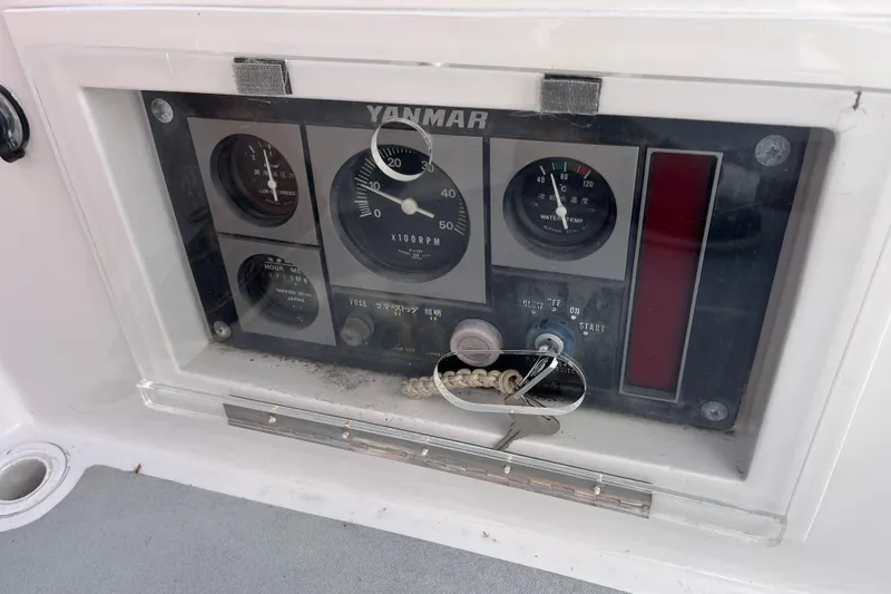 Slide: The Image of Control panel of a 1995 Able Apogee 50 sailboat with Yanmar engine gauges. - 70