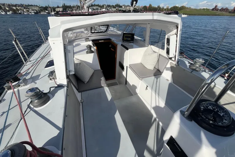 Slide: The Image of Sailboat cockpit view of 1995 Able Apogee 50, featuring seating and navigation equipment. - 47