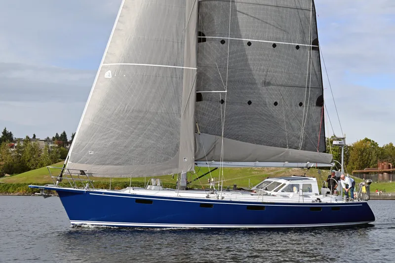 The Image of Sailing yacht Able Apogee 50, 1995 model, with blue hull and large sails on water. - 0