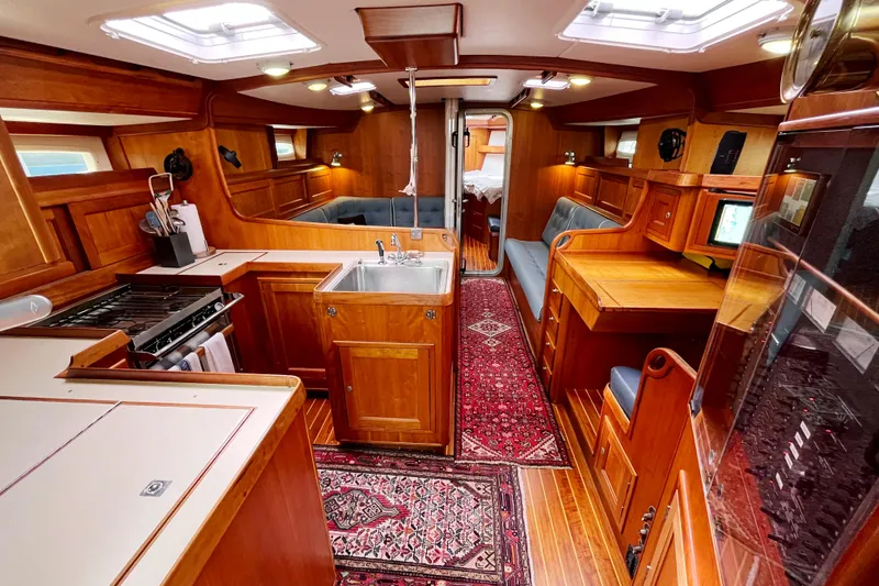 Slide: The Image of Luxurious 1995 Able Apogee 50 yacht interior with wood finish and modern amenities. - 1