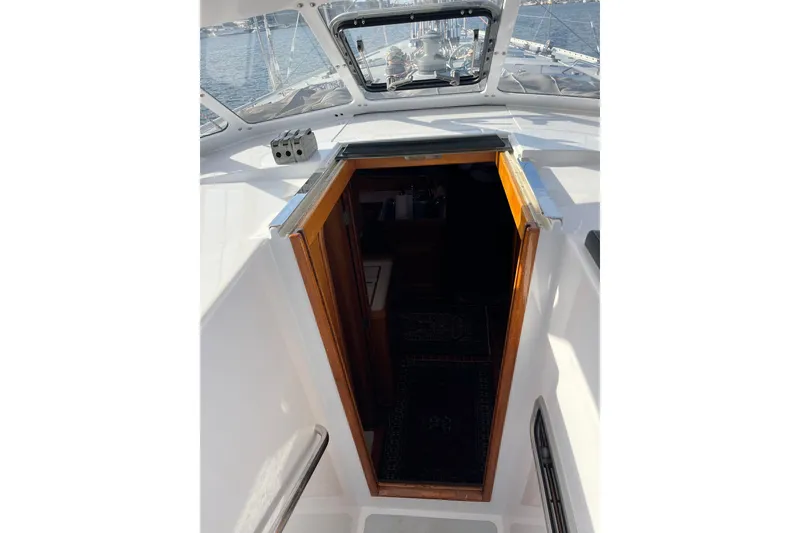Slide: The Image of Entrance to cabin on 1995 Able Apogee 50 sailboat, with open hatch and visible interior. - 53