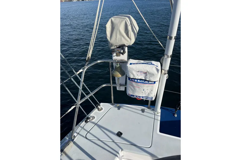 Slide: The Image of Sailboat deck with safety equipment, Able Apogee 50, 1995 model, on calm water. - 66