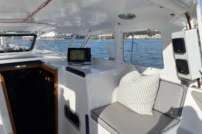 Slide: The Image of Interior of 1995 Able Apogee 50 yacht with navigation system and seating area. - 50