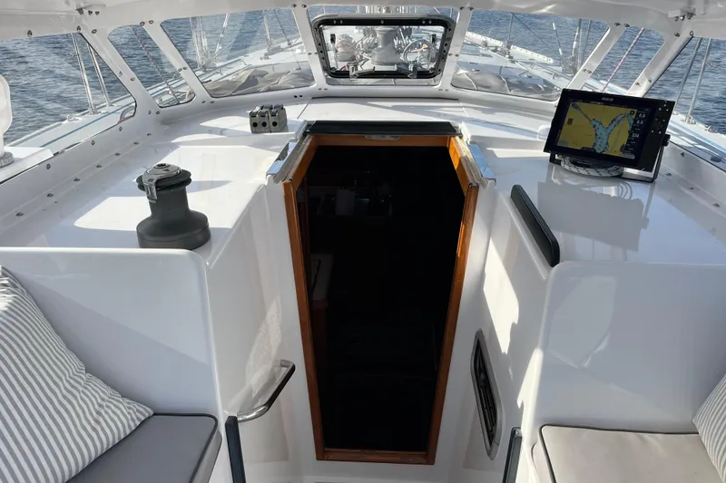 Slide: The Image of Cockpit of 1995 Able Apogee 50 sailboat with navigation system and seating. - 52