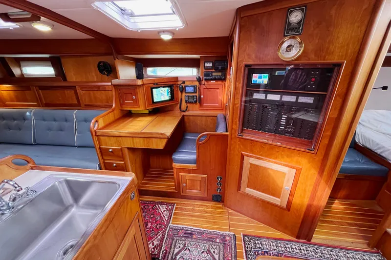 Slide: The Image of Luxurious 1995 Able Apogee 50 yacht interior with wood finish and navigation station. - 10