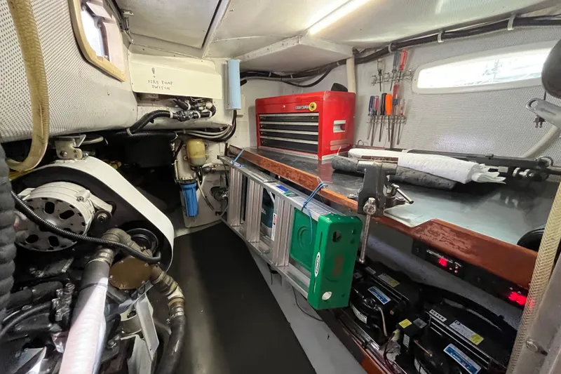 Slide: The Image of Engine room of a 1995 Able Apogee 50 sailboat with tools and equipment. - 30