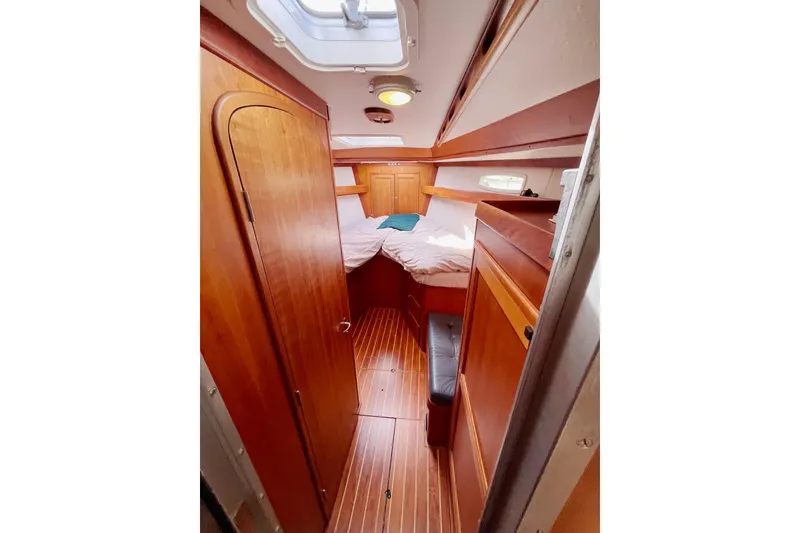 Slide: The Image of Cozy cabin interior of 1995 Able Apogee 50 sailboat with wooden furnishings. - 3