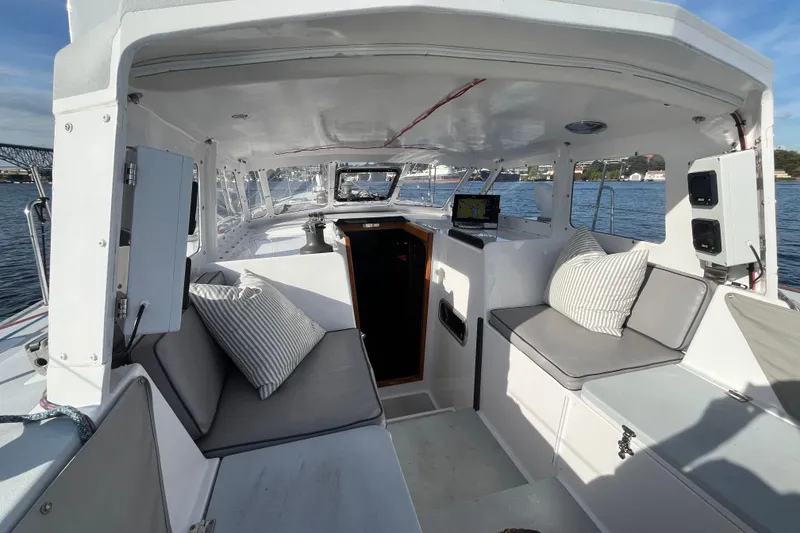 Slide: The Image of Spacious interior of 1995 Able Apogee 50 sailboat with comfortable seating and navigation equipment. - 48