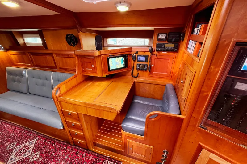 Slide: The Image of Luxurious 1995 Able Apogee 50 yacht interior with navigation station and plush seating. - 12