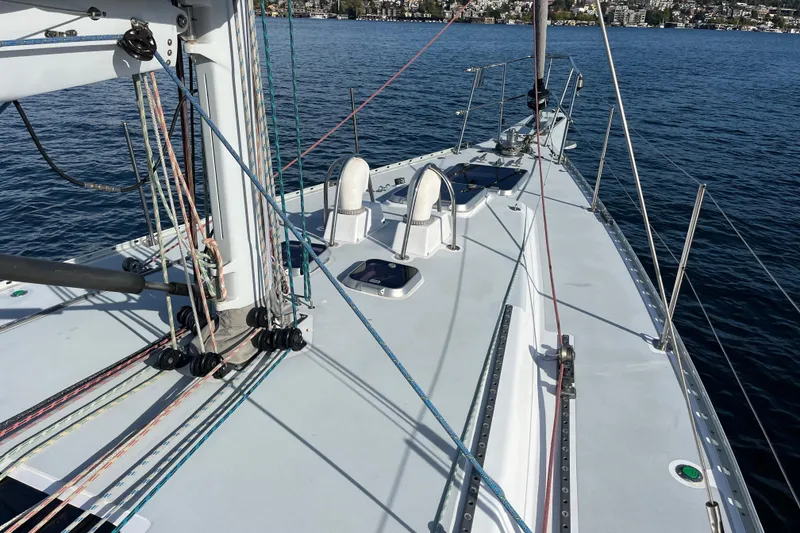 Slide: The Image of Sailboat deck of 1995 Able Apogee 50 on calm water, showcasing rigging and hatches. - 41