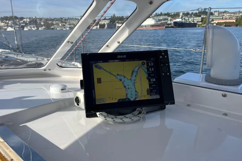 Slide: The Image of Navigation system on 1995 Able Apogee 50 sailboat, with scenic waterfront view. - 54