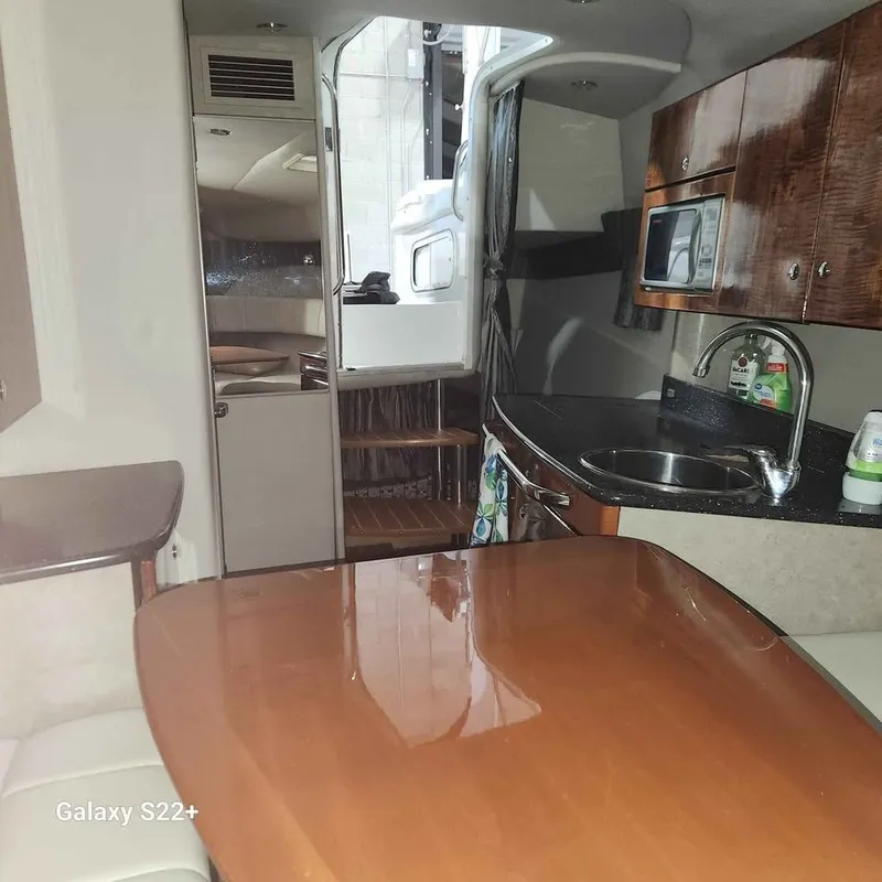 Slide: The Image of Interior of a 2006 Formula 27 PC boat with kitchenette and dining area. - 15