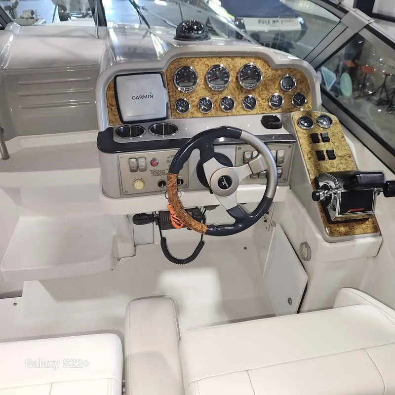 Slide: The Image of 2006 Formula 27 PC boat cockpit with Garmin navigation and classic steering wheel. - 17