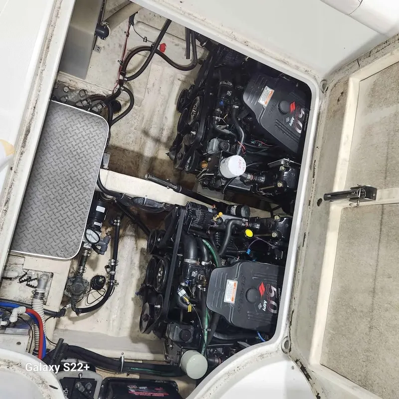 Slide: The Image of Engine compartment of a 2006 Formula 27 PC boat, showcasing dual engines and mechanical components. - 7