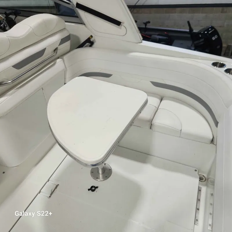 Slide: The Image of 2006 Formula 27 PC boat interior with white seating and table. - 8