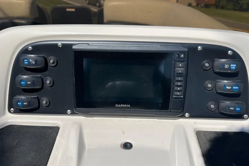 Slide: The Image of Control panel of 2020 Manitou 23 Aurora LE Standard with Garmin display and switches. - 12