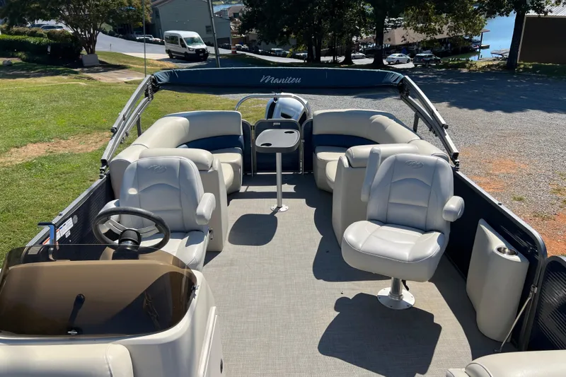 Slide: The Image of 2020 Manitou 23 Aurora LE Standard pontoon boat with spacious seating and modern design. - 6
