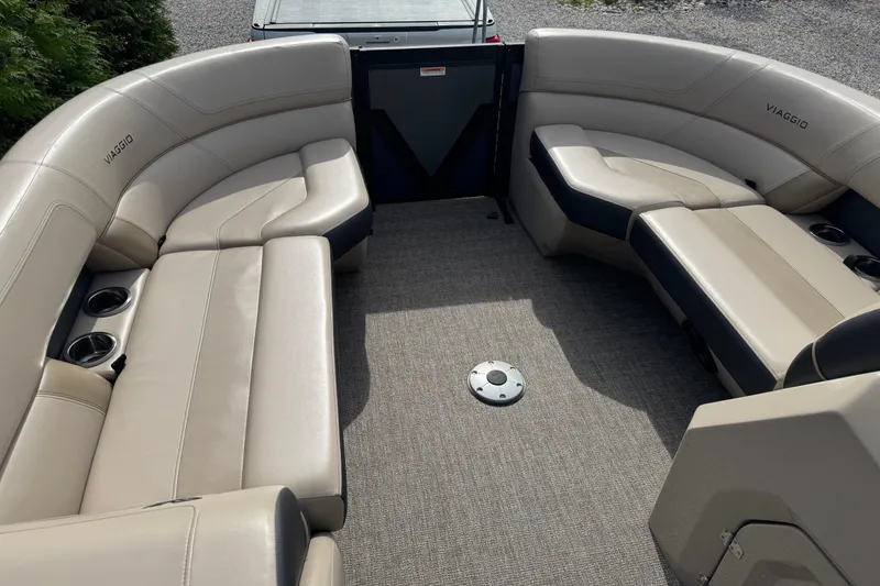 Slide: The Image of 2023 Viaggio DIAMANTE 23S boat interior with beige seating and cup holders. - 10
