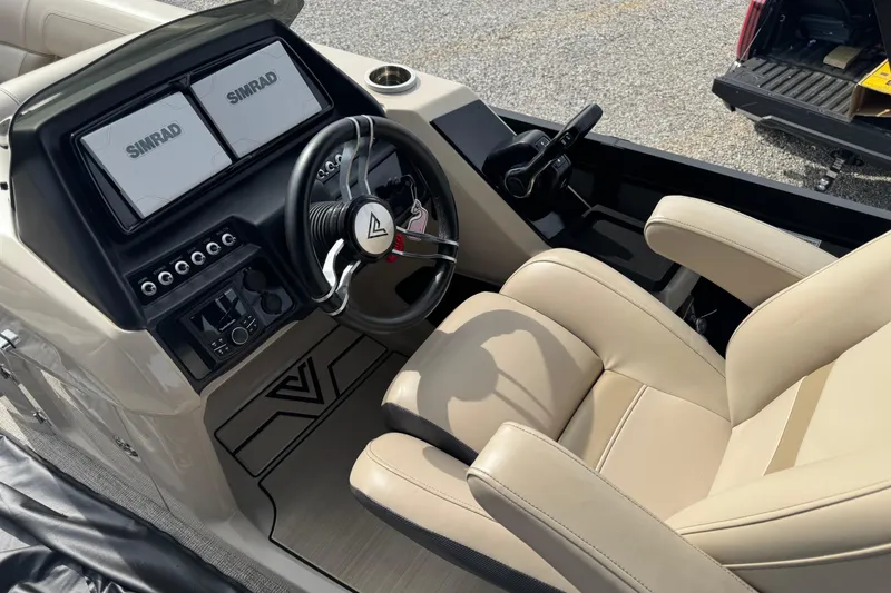 Slide: The Image of 2023 Viaggio DIAMANTE 23S boat cockpit with dual Simrad displays and beige captain's chair. - 12