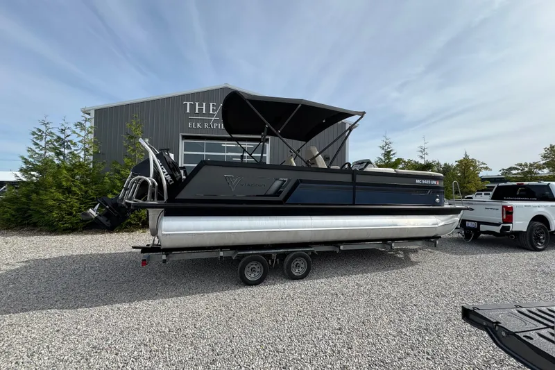 Slide: The Image of 2023 Viaggio DIAMANTE 23S pontoon boat on trailer, parked outdoors. - 6